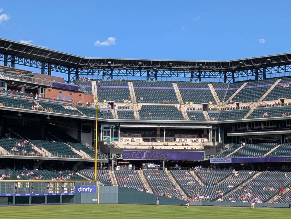 Picture taken from left-field, that shows the purple row of seats that are on the right field side of Coors Field