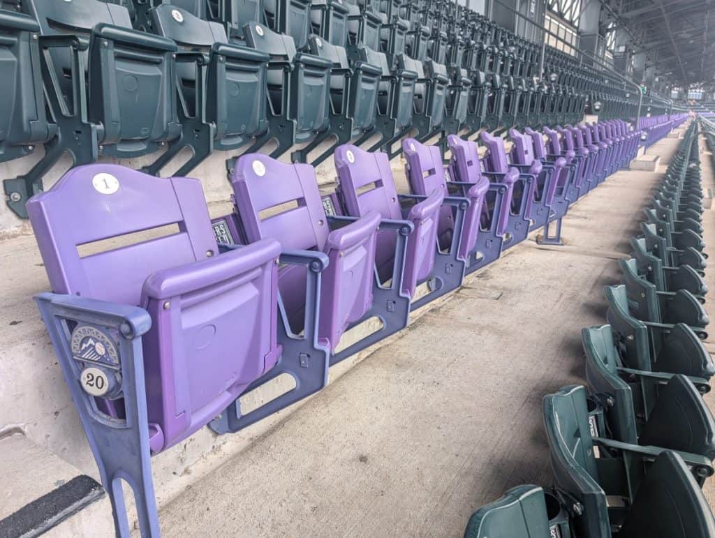 Closeup of the purple row of seats located in the upper deck at Coors Field